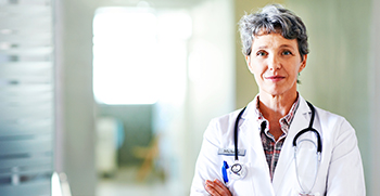 A female doctor standing tall and proud